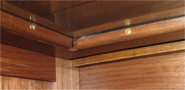 walnut barrister bookcase - screws holding trim and glass in door